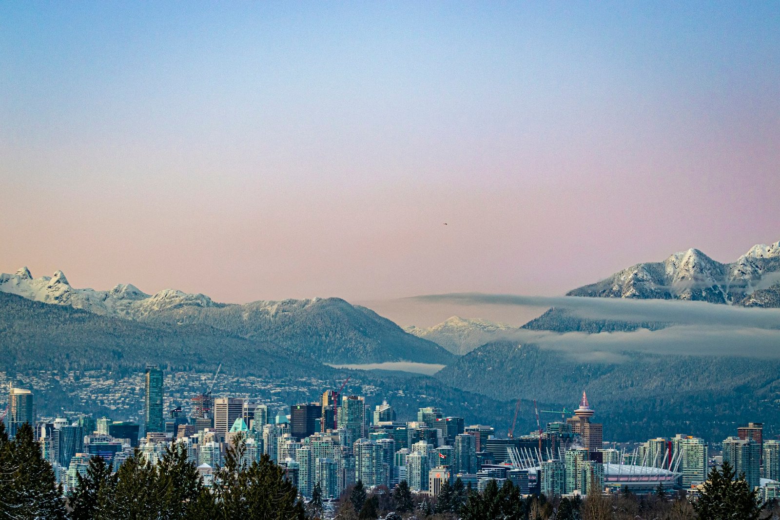 Vancouver skyline and North Shore mountains at dusk